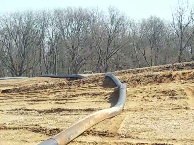 Filling the 4.5-acre spoils retention pond